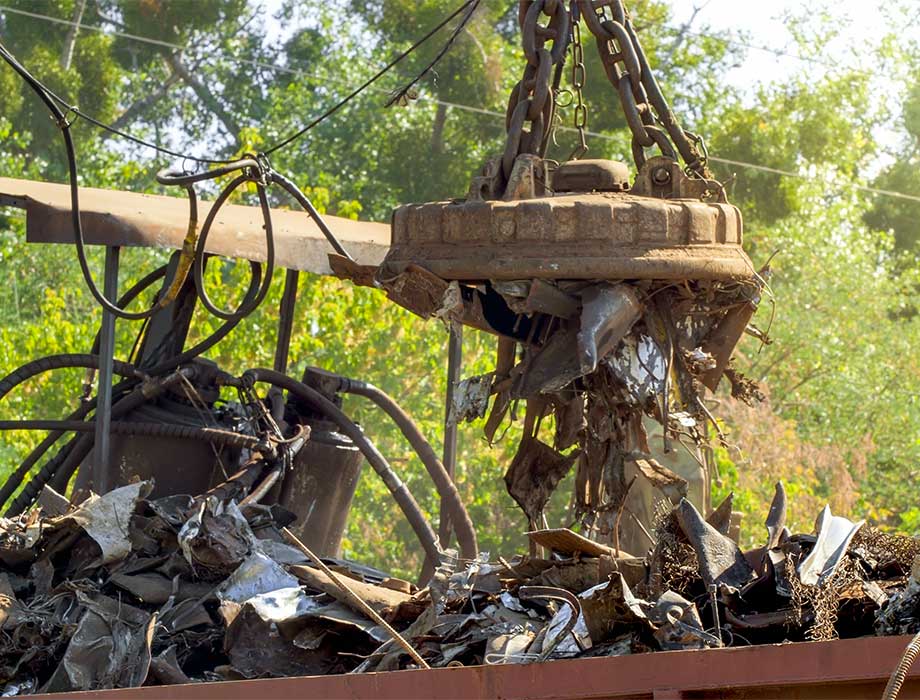 pile of rusty metal garbage on junkyard