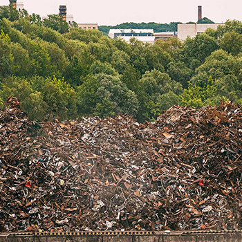 pile of rusty metal garbage on junkyard